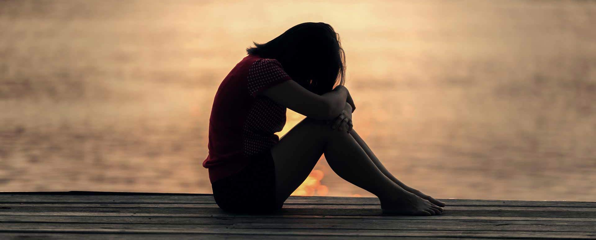 Sad woman on beach